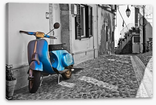 Moped in cobblestone alley, Italy
